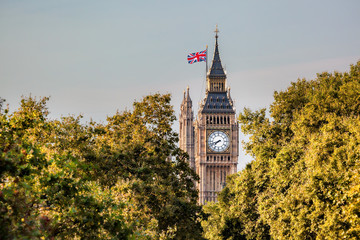Fototapeta na wymiar Famous Big Ben clock against trees in London, England, UK
