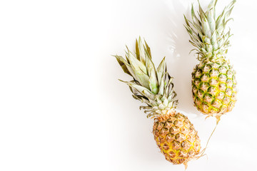 Fototapeta premium pineapple for exotic fruits design on white background top view space for text