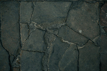 Obraz premium Old cobbles pattern, cobblestone texture, close up view, stone background.