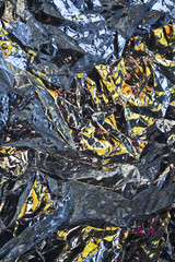 Close Up of Coloured Metal Foil Abstract Background