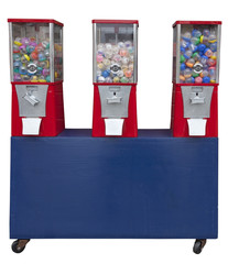 Three vending toy machines on blue wooden rolling cart.