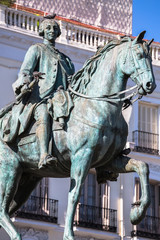 Naklejka premium King Carlos III Equestrian Statue Famous Tio Pepe Sign Puerta del Sol Gate of the Sun Most Famous Square in Madrid Spain