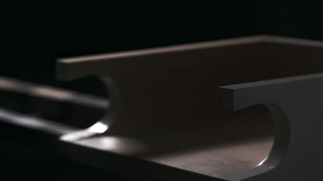 Close up footage in slowmotion. Powder coating in black of wood item
