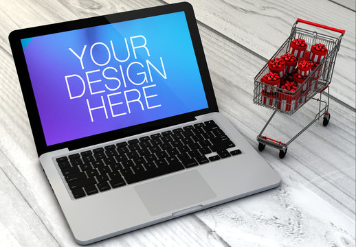 Laptop and Mini Shopping Cart on Wooden Surface Mockup 1