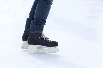 feet skating on the ice rink