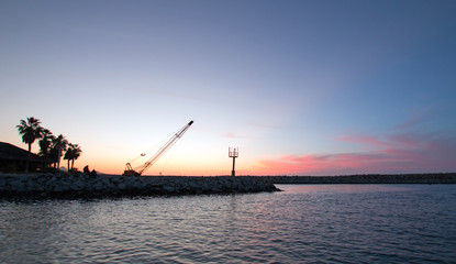 Sunrise over Breakwater / jetty for the Puerto San Jose Del Cabo harbor / marina in Baja Mexico B C S