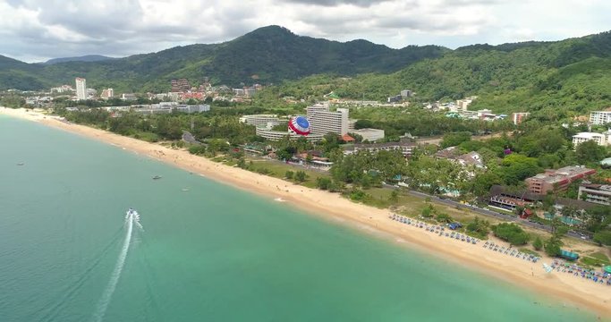 Aerial view of parasailing under beauterful bay and beach. Drone video of parasailing. Phuket, Karon beach, Thailand 2017