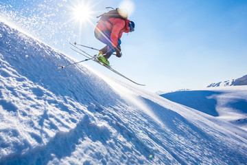 Naklejka na ściany i meble good skiing in the snowy mountains, Carpathians, Ukraine, good winter day, ski jump, ski season