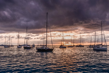 Sailboats at sunset in the sea