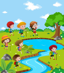 Children hiking up the river