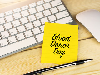 Blood donor day, international world blood donation day on sticky note on office desk