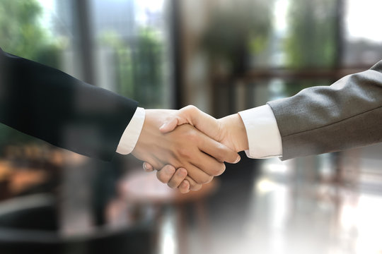 M&A (MERGERS AND ACQUISITIONS) , Businessman handshake working at office M&A