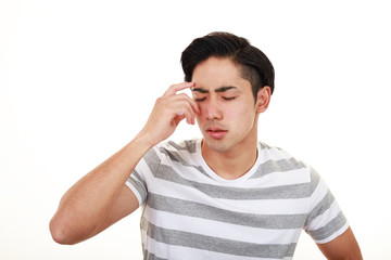 Fototapeta premium 頭痛を訴える男性