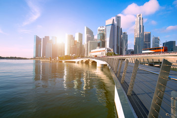 Bridge near Marina bay in Singapore with Singapore skyscraper in background