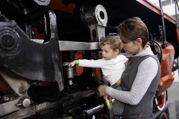 Child touching locomotive