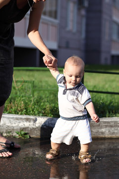 Child And Puddle