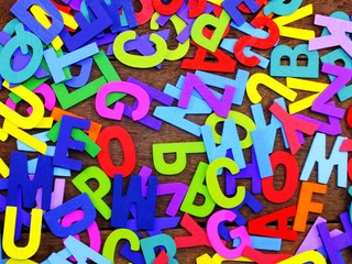 colorful wooden alphabet sunday spelling on wooden background