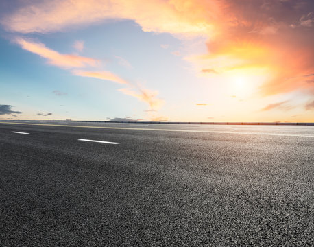 New asphalt highway road at sunset