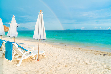 Fototapeta na wymiar Beautiful luxury umbrella and chair on beach