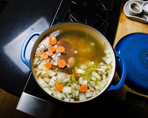 Vegetable ham soup cooking on the stove