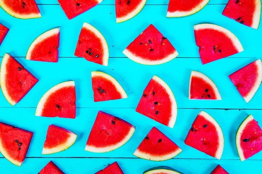 Watermelon on blue rustic wood background