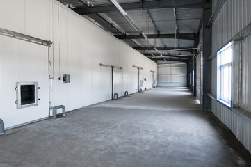 big freezer warehouse at the plant. facade with industrial freezer warehouse door