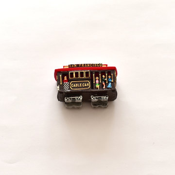 Wooden cable car miniature on a white background
