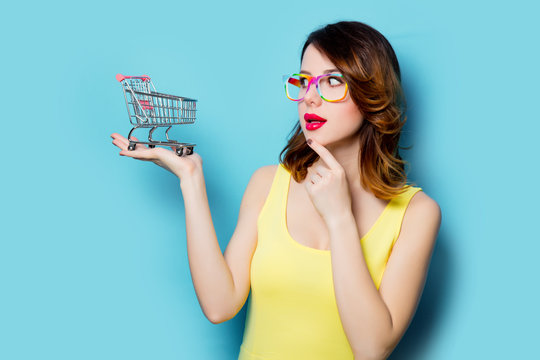 young woman with shopping cart