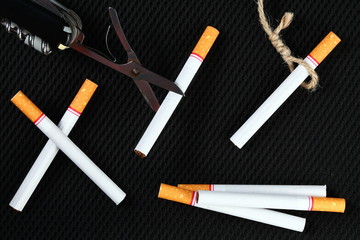 Cigarette and scissors represent stop smoke cigarette concept idea.