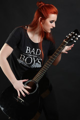 Obraz na płótnie Canvas girl with a guitar