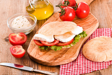 Puccia bread with mozzarella and tomato.