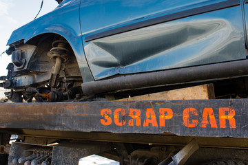 Recycling scrap car removal service for future dismantling and metal and parts reuse.