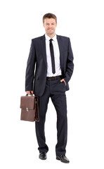 Portrait of an elegant handsome business man with  suitcase on w