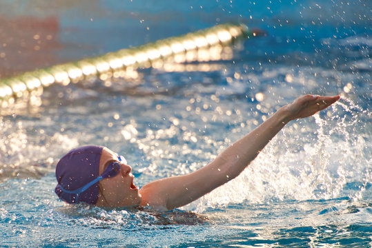 Woman Swim In Open Pool