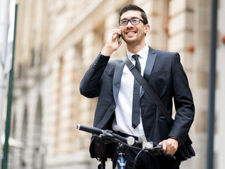 Young businessmen with a bike