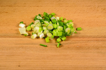 Chopped green onion on woode board