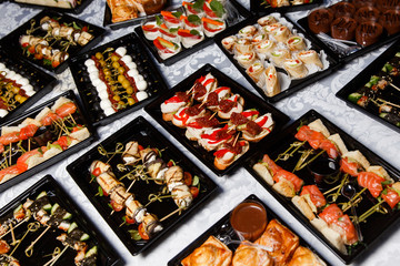 Different snacks at buffet table