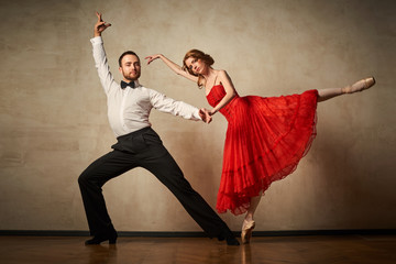 Female ballet dancer and male latin dancer mix the styles together.