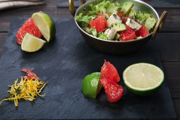 Healthy food - citrus fruit slices in copper bowl