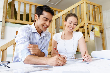 Two young architects in office