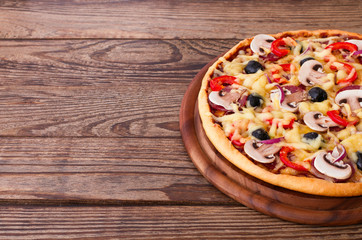 Pizza with seafood on wood table