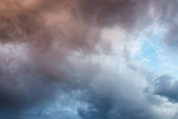 Beautiful clouds at sunset after rain as background .