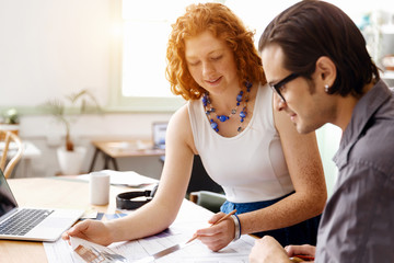 Fototapeta premium Two young architects in office