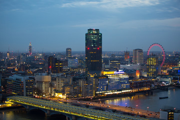 London at night, view at River Thames embankment and London bridge with night lights reflection