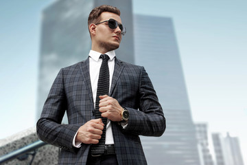 Fashionably dressed man in a modern city, portrait