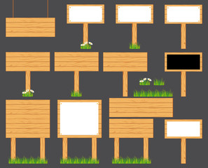 Wooden realistic display signboards standing on the grass or isolated. Vector collection on grey background.