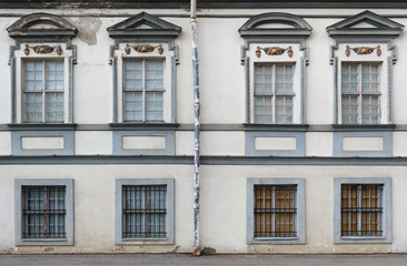 Eight vintage windows with rusty steel lattices