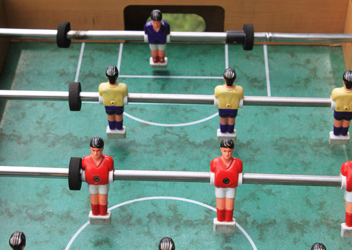 Detail of table football soccer game with red and yellow players
