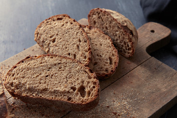 Sliced bread on wooden board