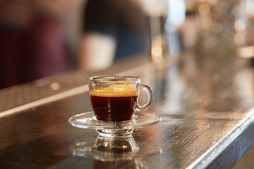 Cup of coffee on bar counter